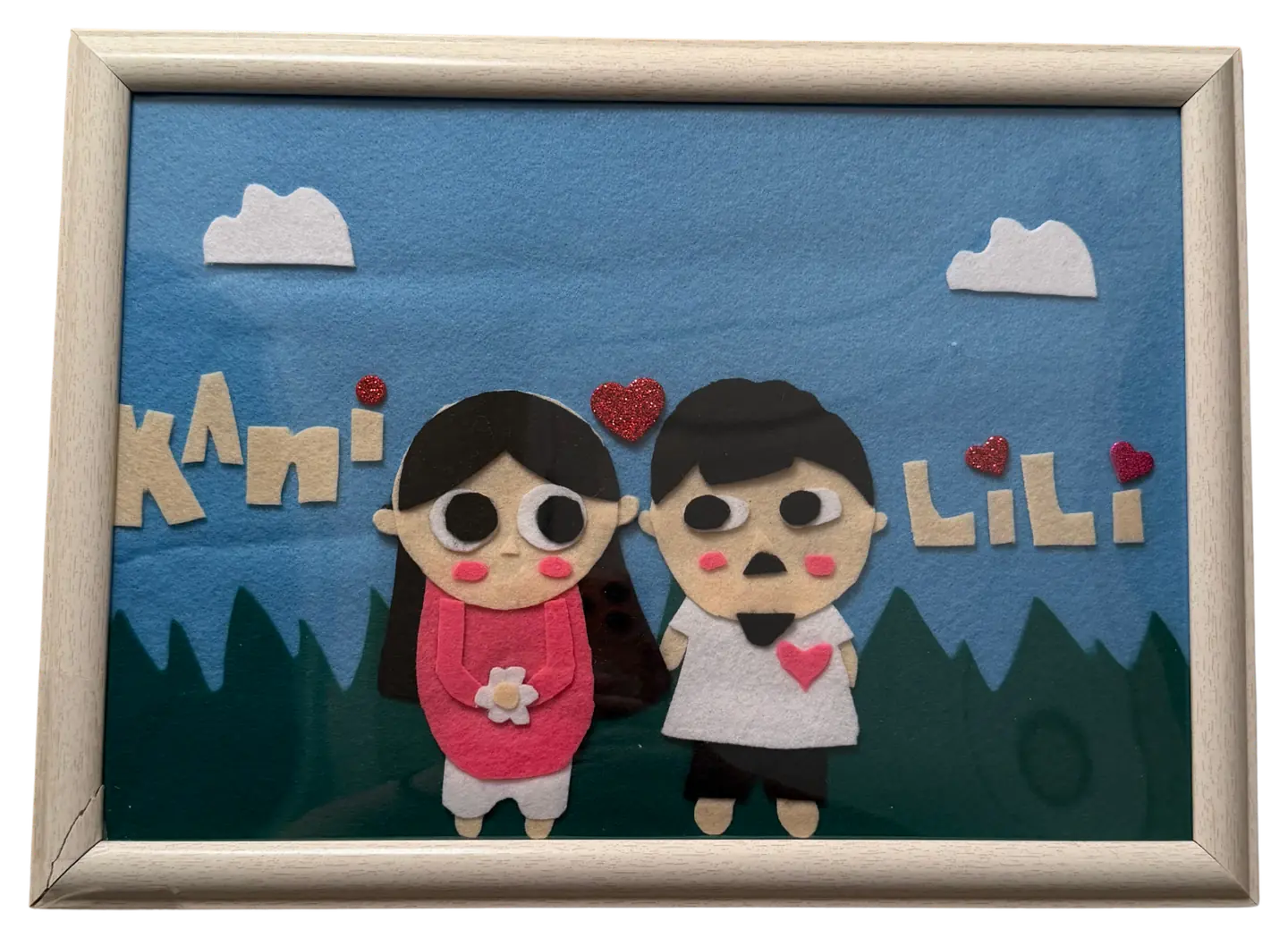 A handmade felt craft of Kani and Lili
